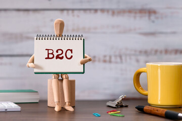 There is notebook with the word B2C. It is as an eye-catching image.