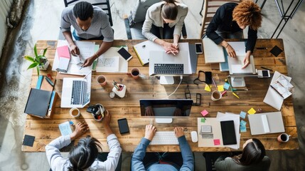 A group of diverse professionals brainstorm ideas in a creative workspace. AIG535