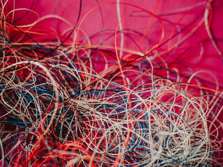 Chaotically tangled threads. Embroidery threads randomly woven. Huge knot. Extreme macro. Beautiful story for intro. Title credits. Abstract screensaver. Handicraft concept, entropy, disorder measure