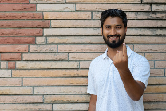 Picture of an Indian man showing his finger after casting vote in election. Lok sabha, vidhan sabha, polls, election commission of india, technology, democarcy, voice, choice, rajasthan, maharashtra