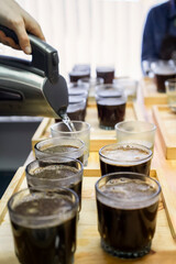 Taster Barista Preparing Coffee for Cupping Quality Test