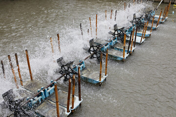 Fototapeta premium Water turbines in water for increase oxygen to water