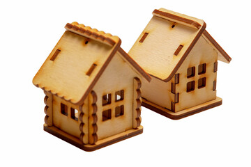 Two wooden models of houses on a white background. Isolated.