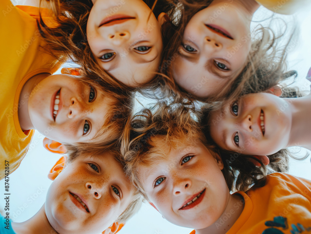 Poster a close-up of smiling children from a low angle view against a clear sky, showcasing a concept of ch