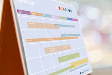 Desk calendar in office workplace concept time management event planner or personal organization for business meeting and appointment reminder and schedule planning or holiday plan.