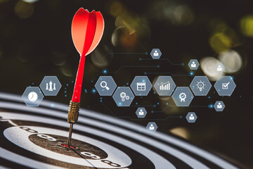 Bullseye target goal or dartboard has dart arrow throw hitting center shooting with strategy...