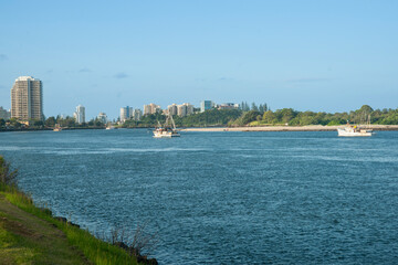 Tweed River and city with prawn boats heading out,