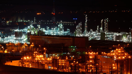 Fototapeta premium A night view of an industrial complex where the lights are not turned off 24 hours a day.