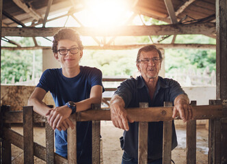 Father, son and together in ranch for farming with livestock, sustainability or family business for future. Male people, shed and agriculture with eco friendly practice and happy in Australia