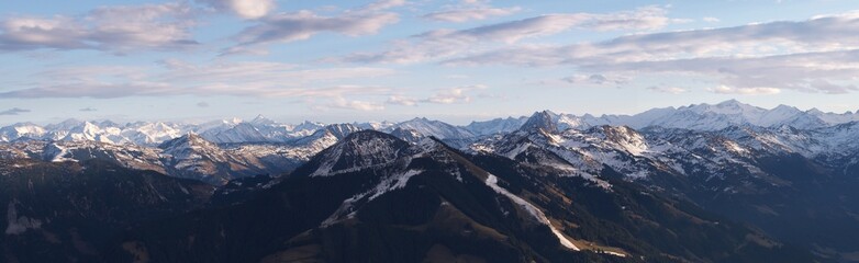 Mountain panorama showing the effects of global warming on the ski slopes of the Austrian Alps in January. Only a handful of runs can be seen. kept open with artificial snow.