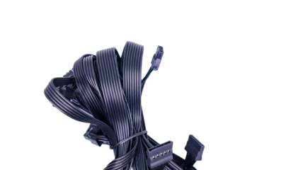 A tangled bundle of black PC cables with connectors isolated on a white background. Black PC Cables with Connectors.