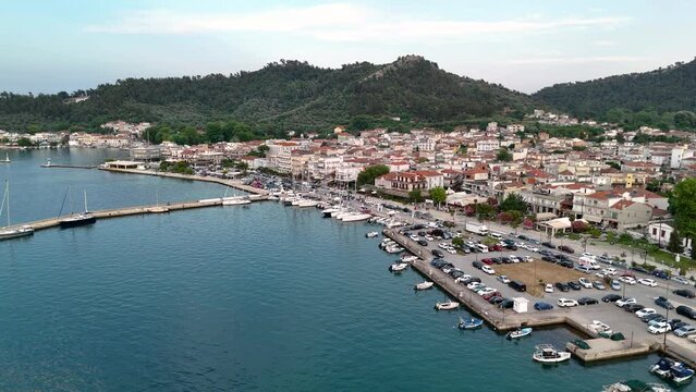 Aerial drone view of Limenas or Thassos City in Thassos Island , Greece. Establishing bird's eye view of a harbor town