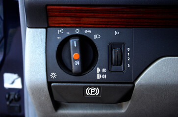 Close up classic car light control. Old Car Headlight switch, fog lights switch, automatic control...