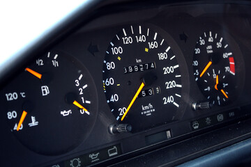 Fototapeta premium Old car speedometer with high mileage. Dashboard of oldschool car. Old car dashboard.