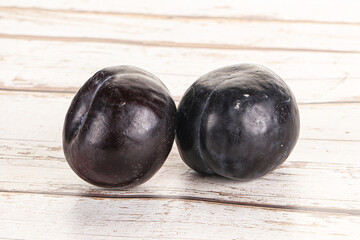 Two ripe sweet black plums