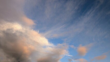 Fototapeta premium Cloudy sunset dramatic skies background, evening colourful sky template, painted clouds wallpaper
