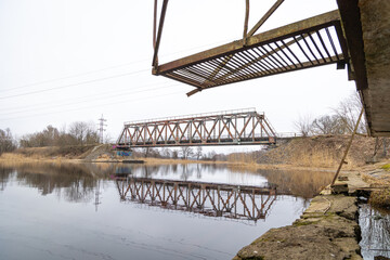 Springtime details near the metal bridge over the river. Overcast april day in Riga, Latvia.