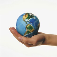 Globe Held in a Hand Against White Background