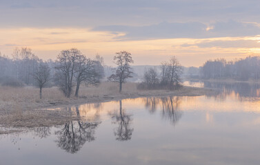 A beautiful spring sunrise at the river. Natural outdoors scenery in Riga, Latvia, Northern Europe.