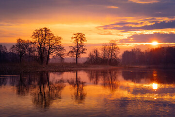 A beautiful spring sunrise at the river. Natural outdoors scenery in Riga, Latvia, Northern Europe.