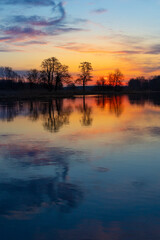 A beautiful spring sunrise at the river. Natural outdoors scenery in Riga, Latvia, Northern Europe.