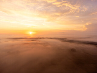 Obraz premium A beautiful misty morning aerophotography of rural landscape in Latvia. Natural summer scenery in Northern Europe.