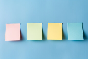 Four empty sticky notes on blue pastel background. Generative AI