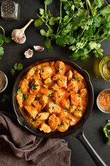 Delicious chicken tikka masala curry in cast iron pan