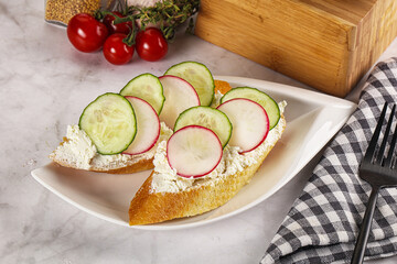 Bruschetta with soft cheese and radishes