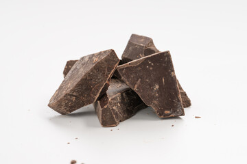 dark chocolate chunks isolated on white background