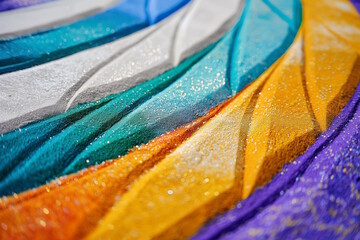 Colorful sand lines creating a sparkling and dynamic effect. Concept for celebrations, festivals, and decorative art