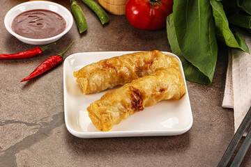 Vietnamese stuffed spring roll served sauce