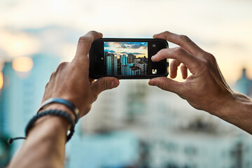 Person, smartphone and screen with city for photography, urban view and mobile phone display for digital image. Hands, closeup and pov of travel photo for memory, social media post and personal blog.