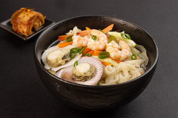 Haemul Kalguksu is Korean Knife Cut Noodle Soup With Seafood.