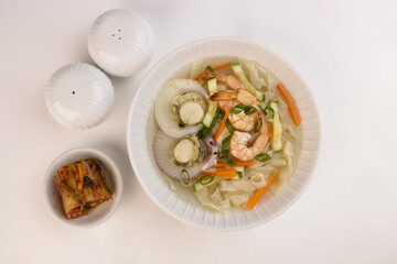 Haemul Kalguksu is Korean Knife Cut Noodle Soup With Seafood.