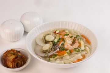 Haemul Kalguksu is Korean Knife Cut Noodle Soup With Seafood.