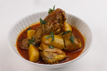 Murgir Jhol or Bengali Chicken Curry is Spicy, delecious and Soupy Chicken Curry With Potatoes.