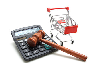 Caculator with Shopping Cart and Wooden judge gavel isolated on white background
