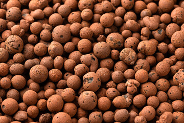 lightweight expanded clay aggregate LECA little balls of clay used in place of soil for houseplants as background