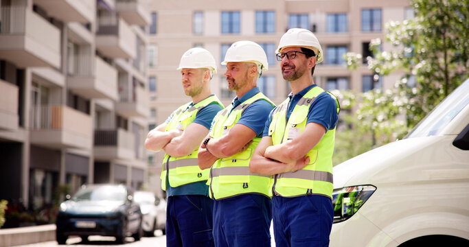 Building Together: Smiling Construction Manager Leads Happy Team