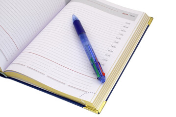 Automatic pen lies on the weekly on a white