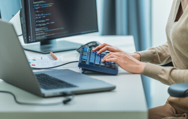 close up  developer hand coding with keyboard on desk  at modern office