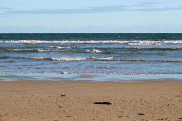 Gentle waves wash the beach - Torquay, Victoria, Australia