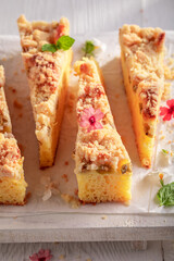 Sweet and tasty gooseberry butter cake served in sunny kitchen.
