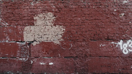 Vibrant Red Brick Wall With Graffiti Close-Up Detail