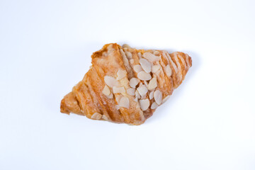 Almond Croissant pastry on a white table. bright mood style. perfect for recipe, article, catalogue, or any commercial purposes. with copy space.
