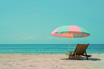 A tranquil scene of a pastel-colored beach umbrella and wooden chair on a serene shore, inviting relaxation and a peaceful retreat by the gentle waves of the ocean.