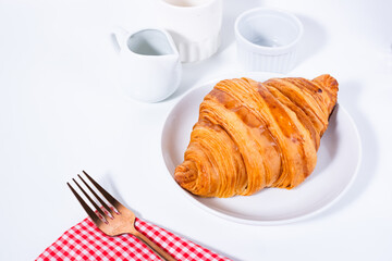 Croissant pastry on a white table. bright mood style. perfect for recipe, article, catalogue, or any commercial purposes. with copy space.