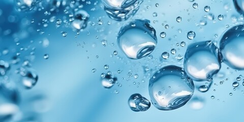 Crystal clear water droplets floating in mid-air with a blue background