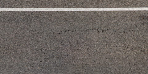 Fototapeta premium view from above on texture of asphalt road with cracks
